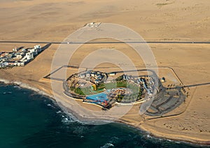 Aerial picture of Afrodite Beach at the Atlantic Ocean on the Skeleton Coast in western Namibia photo