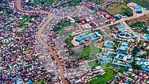 Aerial picture of dense population neighborhood split by the river.