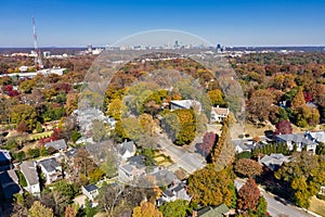 Aerial picture of houses in Midtown Atlanta during the fall with Buckhead buildings in the background