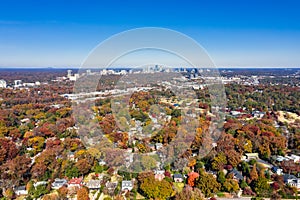 Aerial picture of houses in Midtown Atlanta during the fall with Buckhead buildings in the background