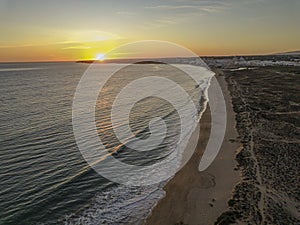 Aerial picture over Gale beach in Portugal during sunset in summer