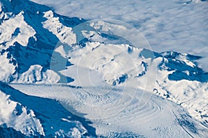 Aerial picture of the snowcovered and glaciated Alaskas mountains photo