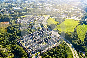 Aerial picture suburban gated community southern united states during sunset and sunrays photo