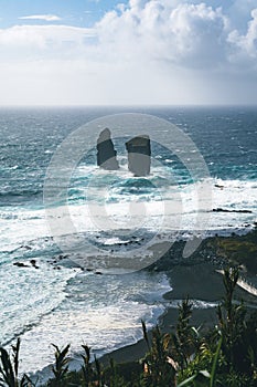 Aerial picture of wild rock formations in the middle of the open atlantic ocean next to Mosteiros, in Sao Miguel island