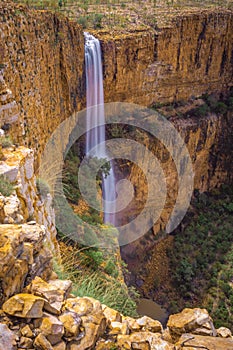 Aerial Portrait view of spectacular double drop unamed waterfall in the Cockburn Ranges, El Questro Resort, Kimberley, Western