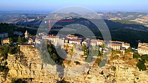 Aerial push-in fly-over shot of Montefalcone Appennino (Fermo) with cliff