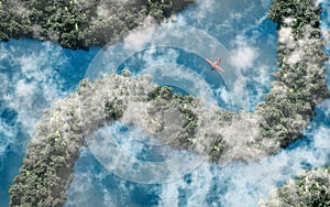 Aerial of red airplane flying over rainforest with river and clouds.