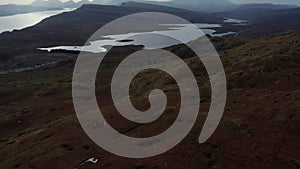 Aerial reveal of rivers, mountains and the coast of Isle of Skye