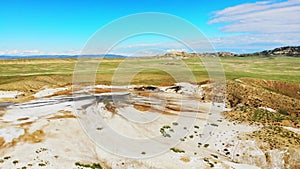 Aerial revealing view scenic natural mud volcanoes formations in Chachuna nature reserve