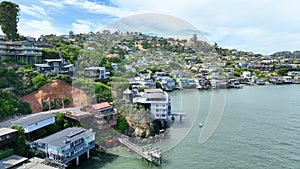 Aerial of rich houses against rocky coastline in Tiburon California