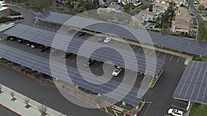 Aerial, rising, drone shot, tilting over a parking lot full solar panels, Santa Clarita, California, USA