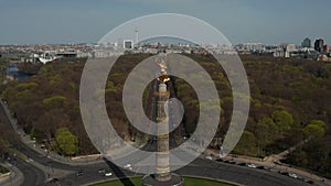 AERIAL: Rising over Berlin Victory Column Golden Statue Victoria in Beautiful Sunlight and Berlin, Germany City Scape