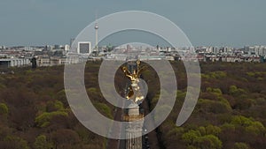 AERIAL: Rising over Berlin Victory Column Golden Statue Victoria in Beautiful Sunlight and Berlin, Germany City Scape