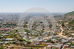 Aerial or rock view of African town Lubango with colorful houses in Angola photo