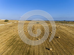 Aerial rolled hay farmland fields countryside landscape in Alentejo, Portugal.
