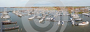 Aerial from sailing boats in the harbor in Friesland the Netherlands