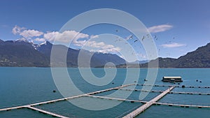 Aerial salmon farms at Reloncavi marine strait at Llanquihue National Park, Chile, South America.