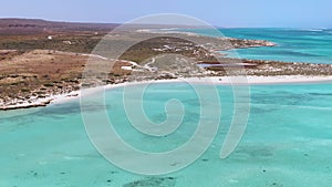 Aerial Sandy bay beach in Ningaloo reef near Exmouth in Western Australia. WA Tourism, recreation and camping concepts.