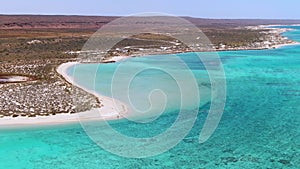 Aerial Sandy bay beach in Ningaloo reef near Exmouth in Western Australia. WA Tourism, recreation and camping concepts.
