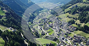 Aerial of Santa Christina in Val gardena. Beautiful Alpine town in spring 4K