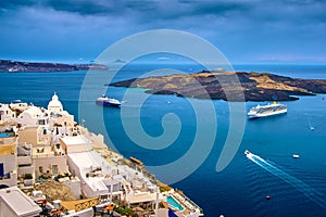 Aerial of Santorini island and towns and cruise ships in bay, Greece