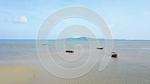 Aerial scene of Nice Thailand Beach with Boats in the Sea,Fly Forward to Blue Sky