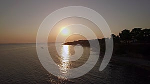 Aerial scene of shore and sea with boats at sunset, Greece