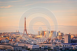 Aerial scenic view of Paris with the Eiffel tower at sunset, Montmartre in the background, France city travel concept