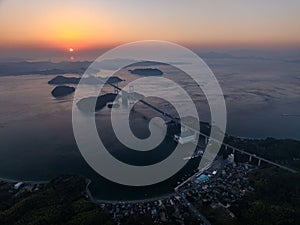 Aerial of the Shiminami Kaido Bridge in Shikoku, Japan during the sunset