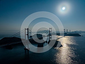 Aerial of the Shiminami Kaido Bridge in Shikoku, Japan under the bright sun