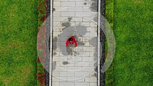 Aerial shoot of Asian woman training her skill in martial arts inside the temple