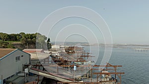 Aerial shooting of fishing docks near Sete city on lake