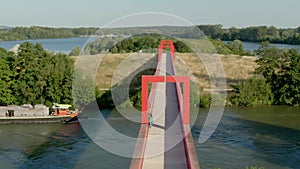 Aerial shooting of a modern conceptual bridge with red