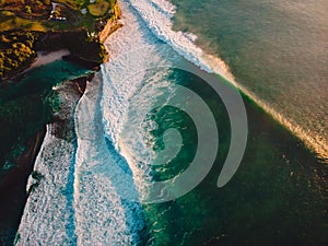 Aerial shooting of storm waves at sunset. Ocean waves in Bali