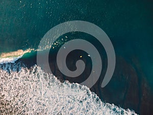 Aerial shooting of surfing. Surfers in tropical ocean