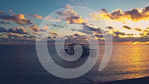 Aerial shot of the abandoned Brighton Pier at sunrise