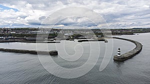 Aerial shot above Seaham lighthouse and pier in 4k, Durham, UK