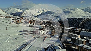 Aerial shot of Alpe d'Huez ski resort on a winter sunny day, high season, France photo