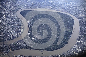 Aerial shot of Bang Krachao sub-district shaped like a pig stomach and the winding Chao Phraya River. Bangkok