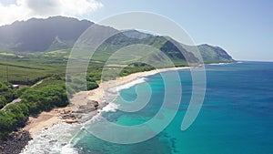 Aerial shot on the beach of Oahu Hawaii. Dream trip to green island. Outdoor adventure travel to beautiful Hawaii beach