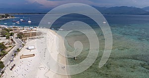 Aerial shot of beautiful beach in Bali, Indonesia. Tropical Beach top view. Drone footage of Halal Toursim Gili