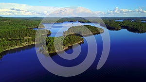 Aerial shot of beautiful islands at lake on a calm summer day.