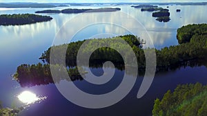 Aerial shot of beautiful islands at lake on a calm summer day.