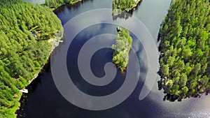 Aerial shot of beautiful islands at lake on a calm summer day.