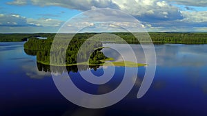 Aerial shot of beautiful islands at lake on a calm summer evening.