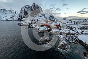 Aerial shot of the beautiful red houses and landscape of the Lofoten Islands