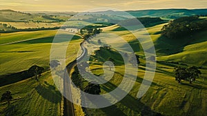 An aerial shot of a biofuelpowered tram passing through a quaint countryside surrounded by rolling hills and green