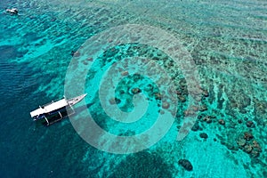 Aerial shot of boat on tropical reef