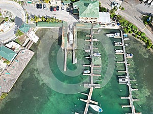 Aerial shot of the boats parked in the harbor in the city