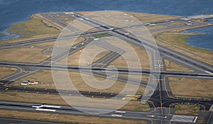 Aerial shot of Boston's Logan International Airport runways with planes taxiing.